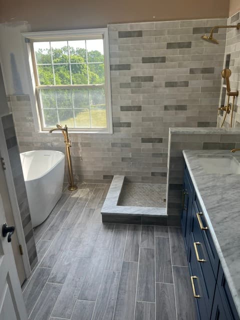 Brushed Gold & Marble Primary Bath — Bathroom tile project in Morganville, NJ by JL Tile & Stone