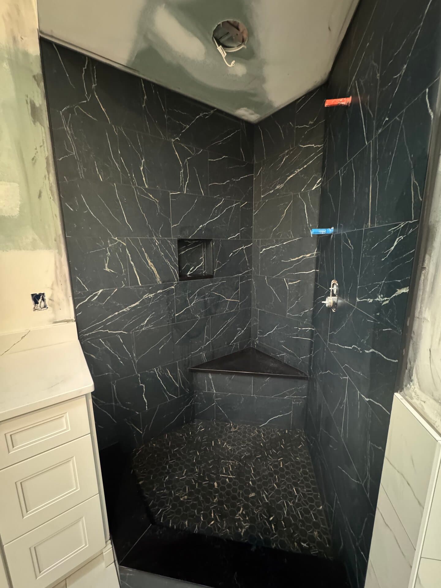 Dark Porcelain Shower Build — tile and stone work photo 1 by JL Tile & Stone, New Jersey